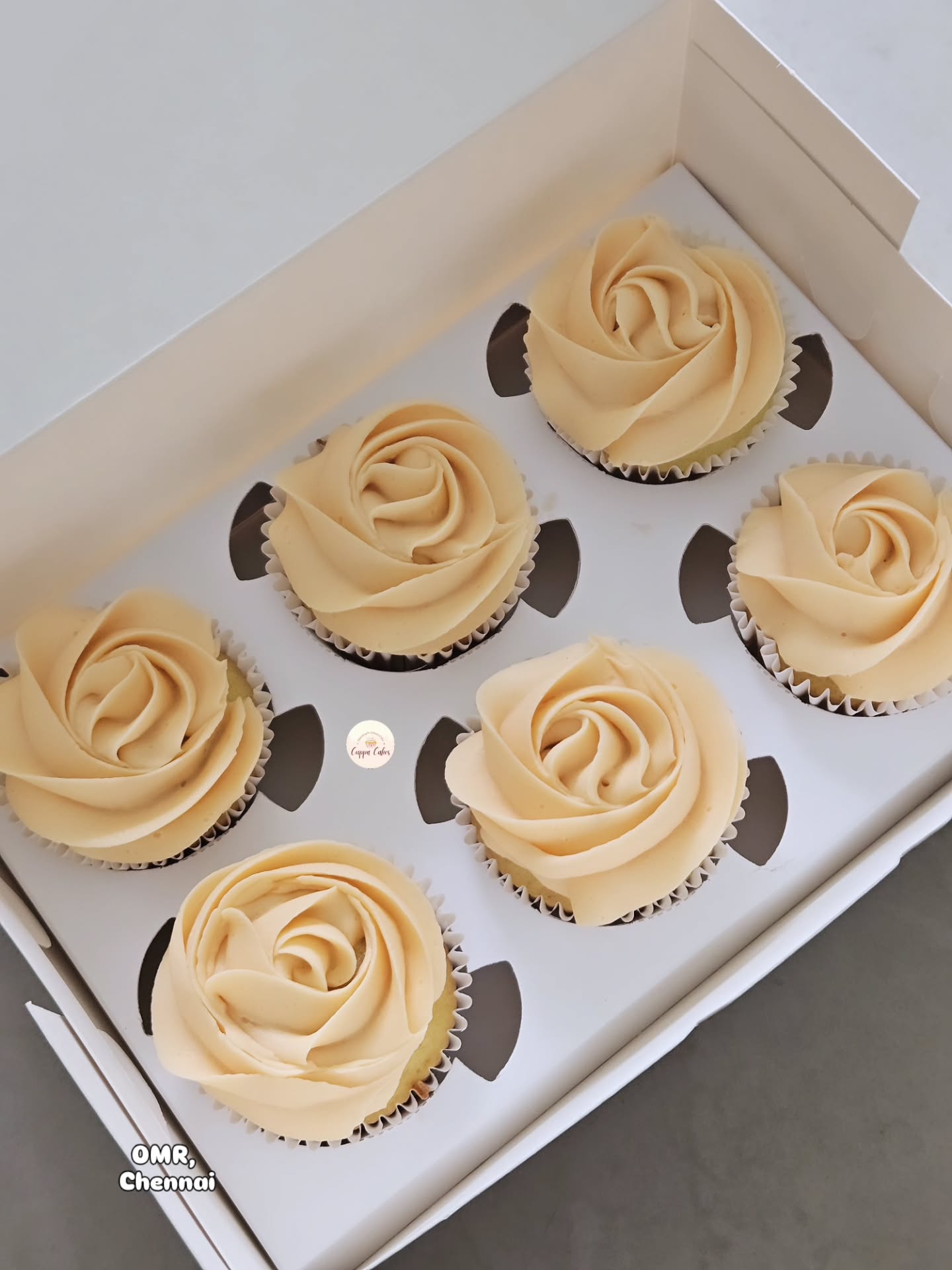 Box of rose-swirl buttercream cupcakes by Cuppa Cakes