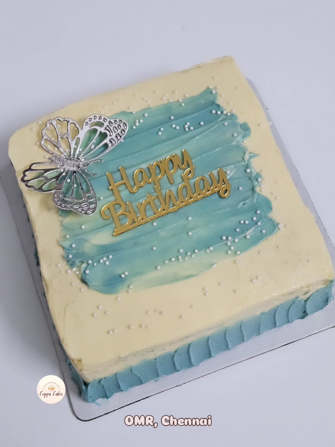 Buttercream sheet cake with butterfly